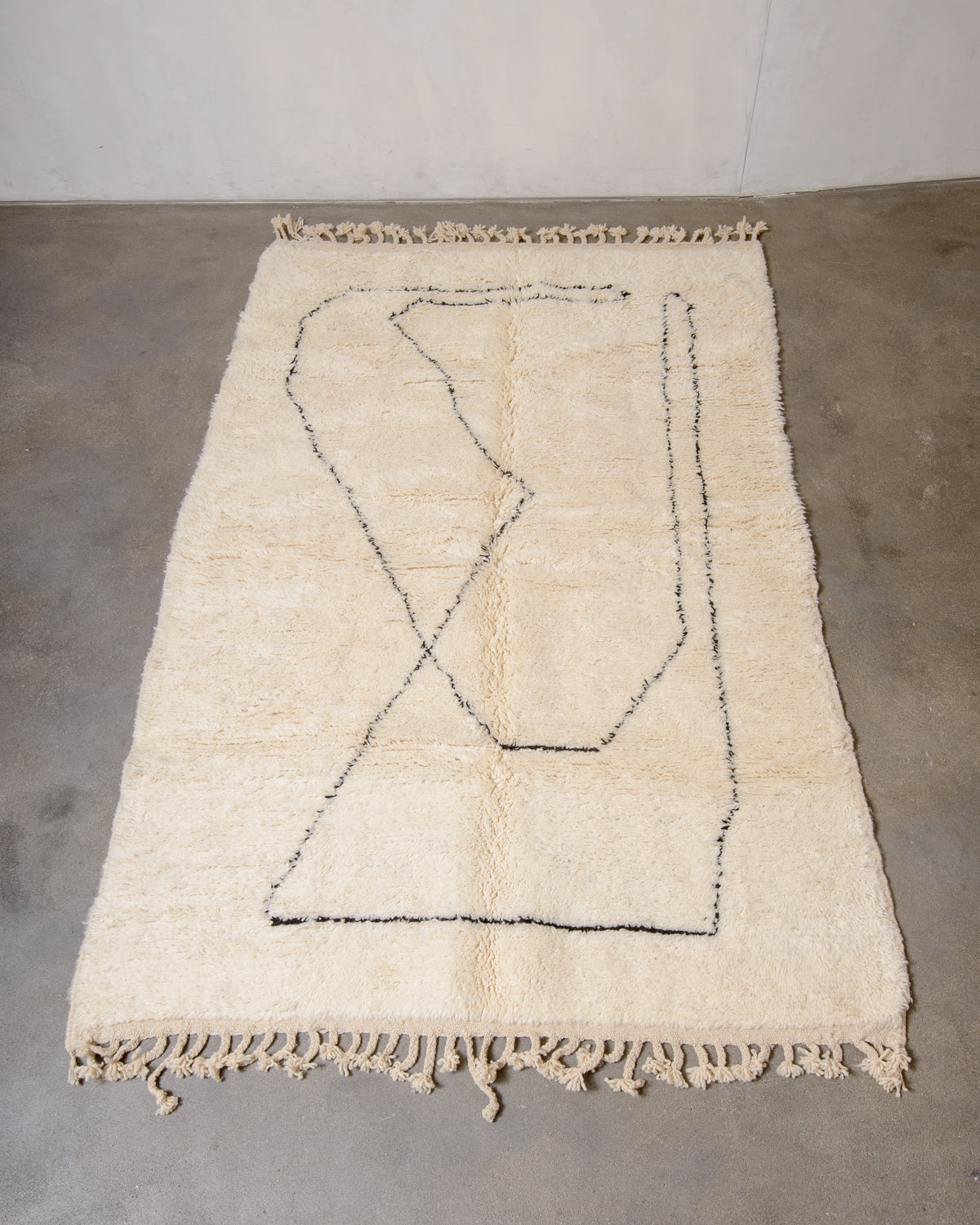 Modern, designer, handcrafted Berber rug from Morocco. Beniourain carpet with minimalist design, natural wool pile and a fluffy texture.